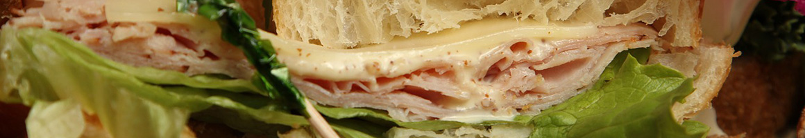 Eating Sandwich at Sandwich Bowl restaurant in Harlan, IA.